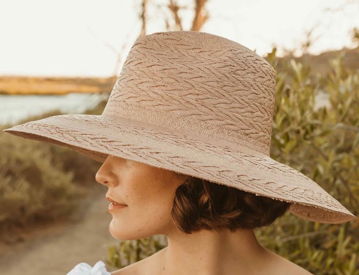 Broad-brimmed fedora with an innovative braid-like woven pattern. 10cm brim Hand Woven Panama Hat from Paja Toquilla straw Each hat is unique and reflects the natural beauty & variation of the handicraft process XS (55cm), Small, Medium (56-57cm), Large (58-59cm), XL (60cm) Spring Braided Toquilla Straw Hat, Natural Woven Fedora, Natural Wide Brim Woven Fedora, Natural Woven Wide-brim Fedora, Natural Handwoven Fedora For Spring, Natural Braided Fedora Straw Hat, Braided Natural Straw Fedora Hat, Natural Braided Straw Fedora Hat, Natural Braided Straw Fedora