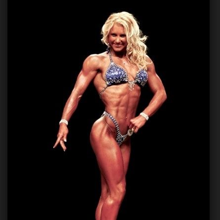 a female bodybuilding competitor posing for the camera