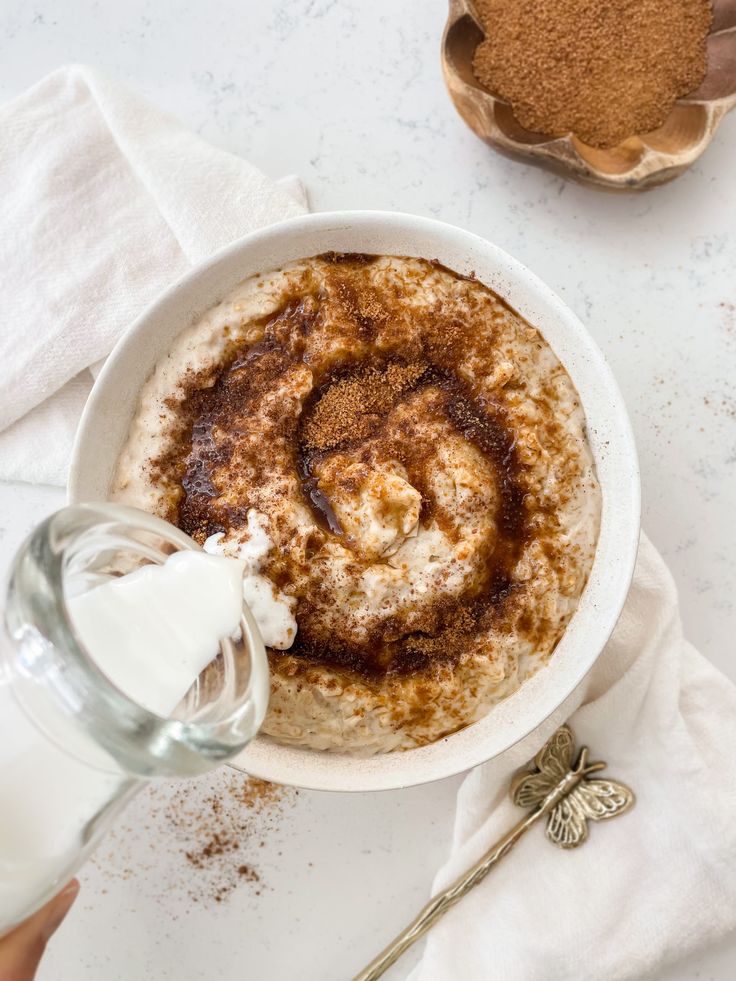 a bowl of oatmeal with cinnamon in it and the words, 9 indulgentt oatmeal recipes