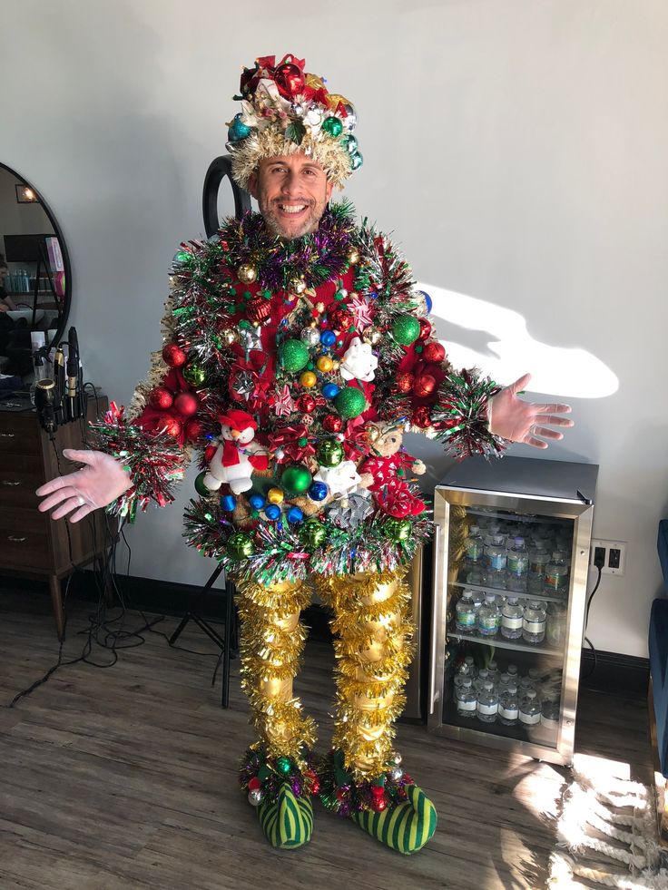 a man dressed up as a christmas tree