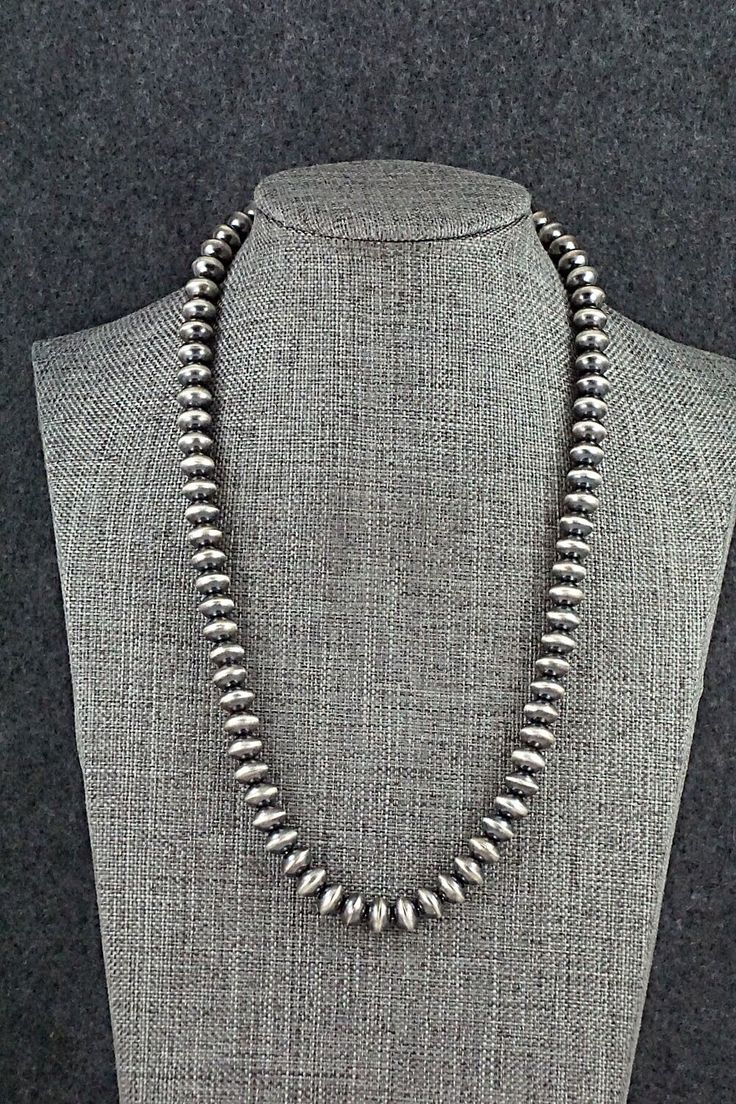 This sterling silver Navajo pearl necklace was made by Navajo silversmith Michelle Jameson.Necklace: 17"Bead size: 5/16" x 1/4"Free shipping on all orders! We ship with USPS and always include tracking. All orders ship within a day of payment.Returns are accepted up to 30 days after you receive your order. Just send us a message. Our shop offers cash back or store credit. The item must be returned in new condition. Southwestern Sterling Silver Concho Necklace, Silver Artisan Necklace With Concho, Silver Southwestern Concho Necklace, Artisan Silver Necklace With Concho, Southwestern Silver Concho Necklace, Pearl Necklace, Jewelry Watches, Pendant Necklace, Sterling Silver