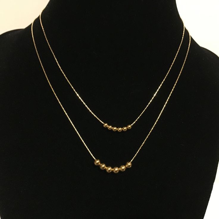 ❤️❤️❤️ On Sale 20% off and Free Shipping ❤️❤️❤️ Customized 14k gold filled bead necklace. You choose length, size and number of beads. Made to order from 14-20 inches with 3mm or 4mm beads. Beads, chain and all components are 14k gold filled - not gold plate. Gold filled jewelry is high quality and does not tarnish. These are free sliding beads and you may choose the size, as well as the number of beads. Please message me for quantities of beads not listed here. Packaged in a complimentary broca Gold Layered Necklace With Delicate Chain And Round Beads, Gold Ball Chain Necklaces For Layering, Gold Layered Necklace With Round Beads, Minimalist Beaded Chain Layered Necklace As Gift, Gold Layered Necklace With Round Beads And Adjustable Chain, Gold Layered Necklace With Beaded Chain And Round Beads, Gold Layered Beaded Necklace, Dainty Gold Beaded Necklace With Delicate Chain, Double Strand Tiny Beads Necklaces For Layering