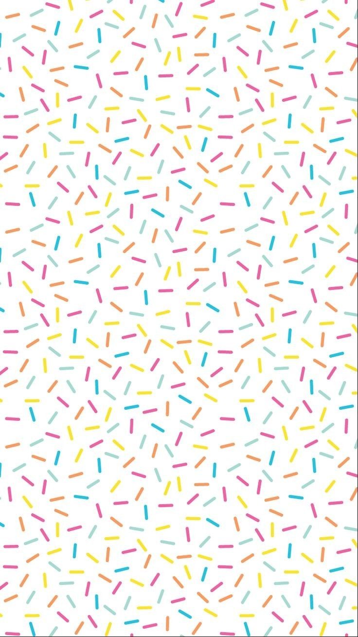 colorful sprinkles on white background