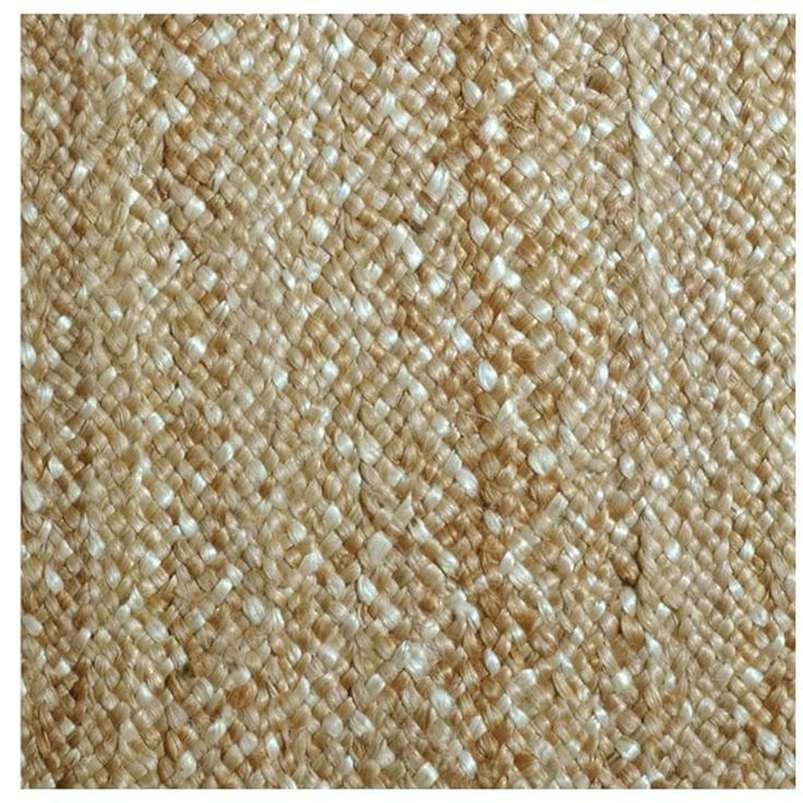 a close up view of the texture of an area rug with white and beige colors