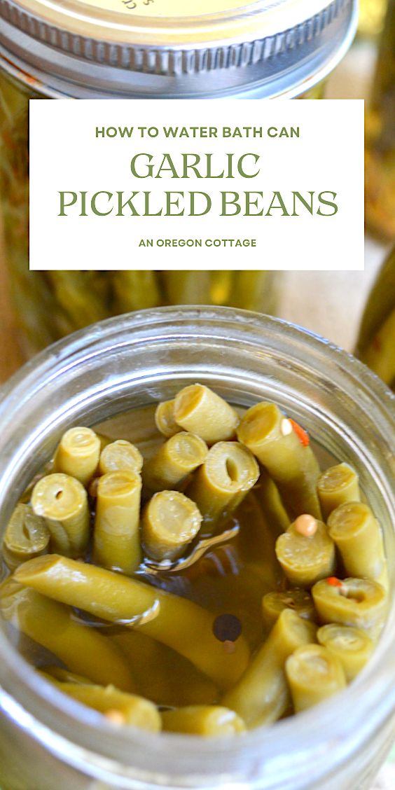 jars filled with pickled beans sitting on top of a table