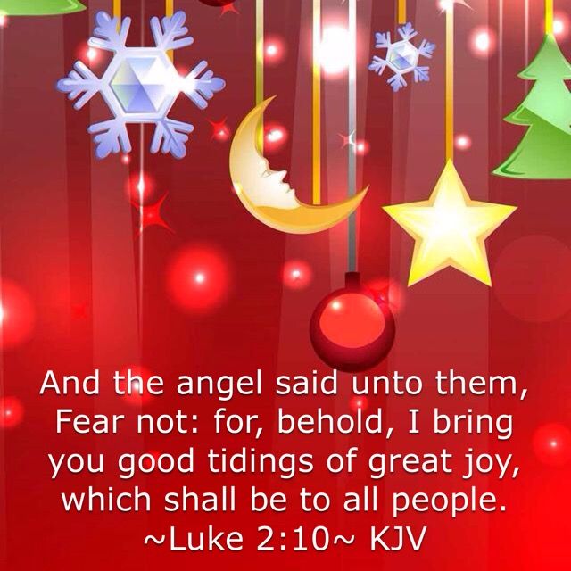 a red background with christmas decorations and the words, and the angel said unto them fear not for behold i bring you