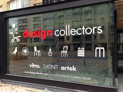 a sign on the side of a building that says design collectors vitra, thonet artek