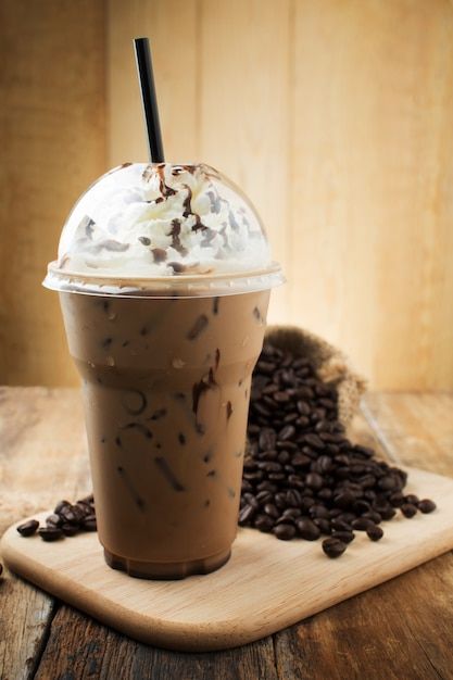 an iced coffee with whipped cream and chocolate sprinkles