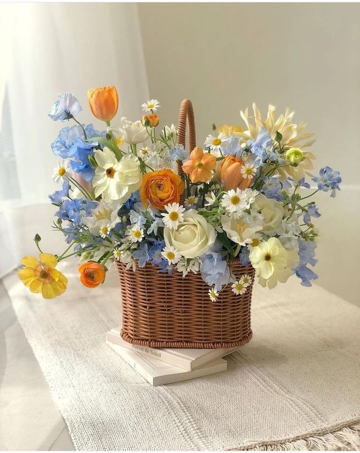 a basket filled with flowers sitting on top of a table