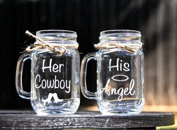 two glass mugs with the words her cowboy and his angel on them