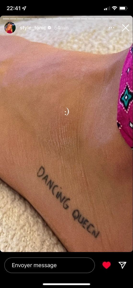 a person's foot with the words dancing queen tattooed on it