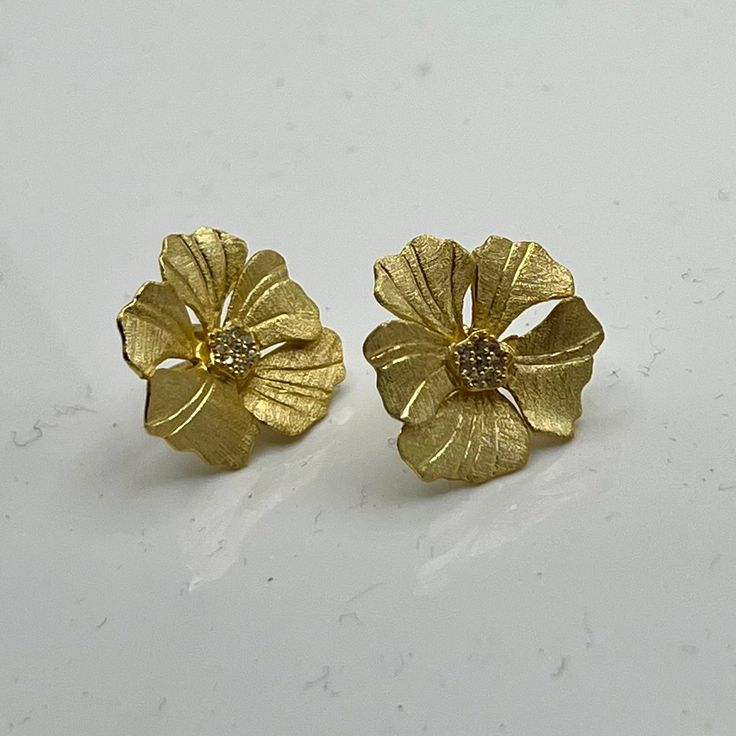 Inspired by the exquisite beauty of peony flowers, these studs exude elegance and sophistication. Crafted with meticulous detail and finished in radiant gold, they add a touch of floral glamour to any ensemble. Perfect for elevating your style with a timeless floral accent, these studs are sure to become a cherished addition to your collection. GV Peony w/CZ Gold Elegant Flower Earrings With 3d Flowers, Elegant Gold Flower Earrings With 3d Details, Elegant Gold Jewelry With 3d Flowers, Formal Rose Gold Flower Earrings, Gold Flower-shaped Earrings For Formal Events, Gold Flower Earrings For Formal Events, Delicate Gold Flower Earrings For Anniversary, Luxury Flower Earrings For Formal Occasions, Luxury Yellow Gold Flower Earrings