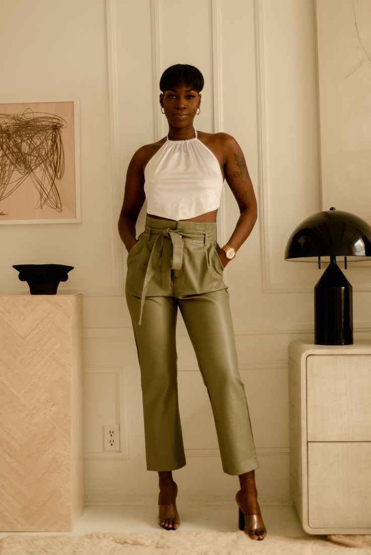 Get ready to make a statement in these beautiful olive green coloured pants. High waisted with pockets and an adjustable front tie to add your own flare of fierceness to your look! Our Sasha pants are perfect for your spring wardrobe and can be paired with a lovely blouse and accessories to compliment. *Accessories and top are not included Fabric: Faux leather, 55% Cotton 45% PU Model is wearing size small Shipping: ﻿Please visit our shipping policy for more information Peach Outfits, Magic Pants, Peach Clothes, Green Outfits, Olive Pants, Pants High Waisted, Colored Pants, Pants Large, Green Outfit