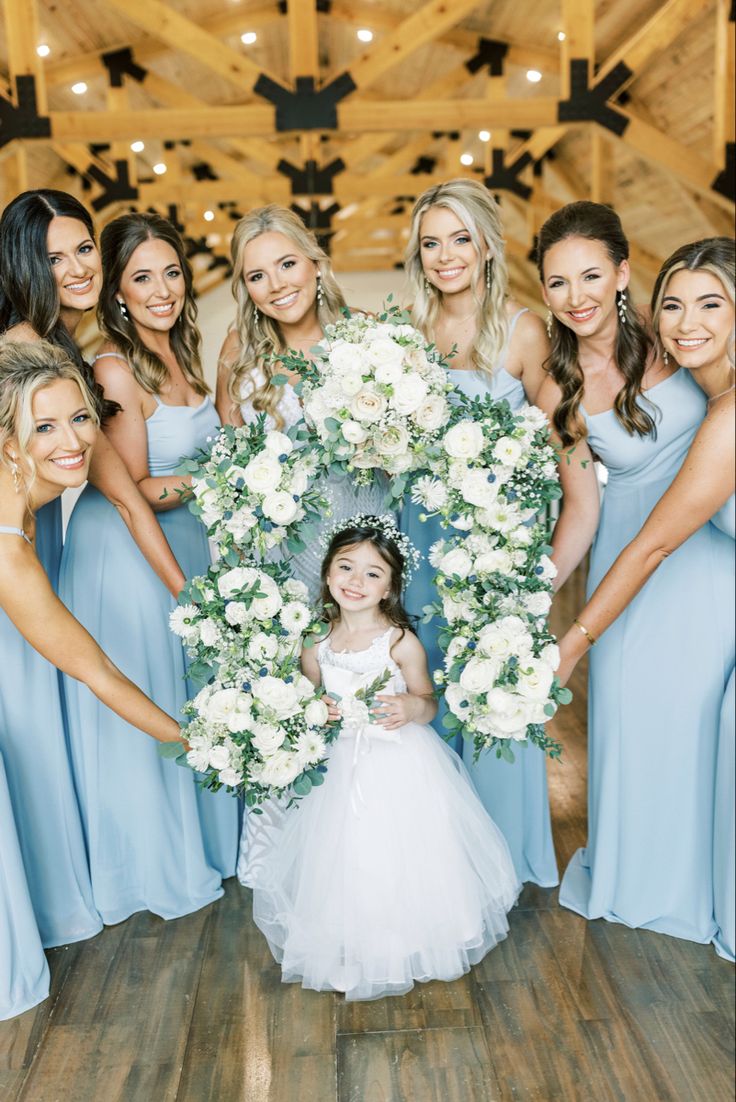 a group of bridesmaids posing for a photo