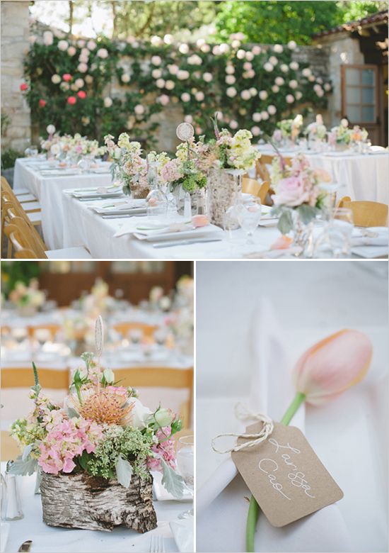 a table with candles and flowers on it