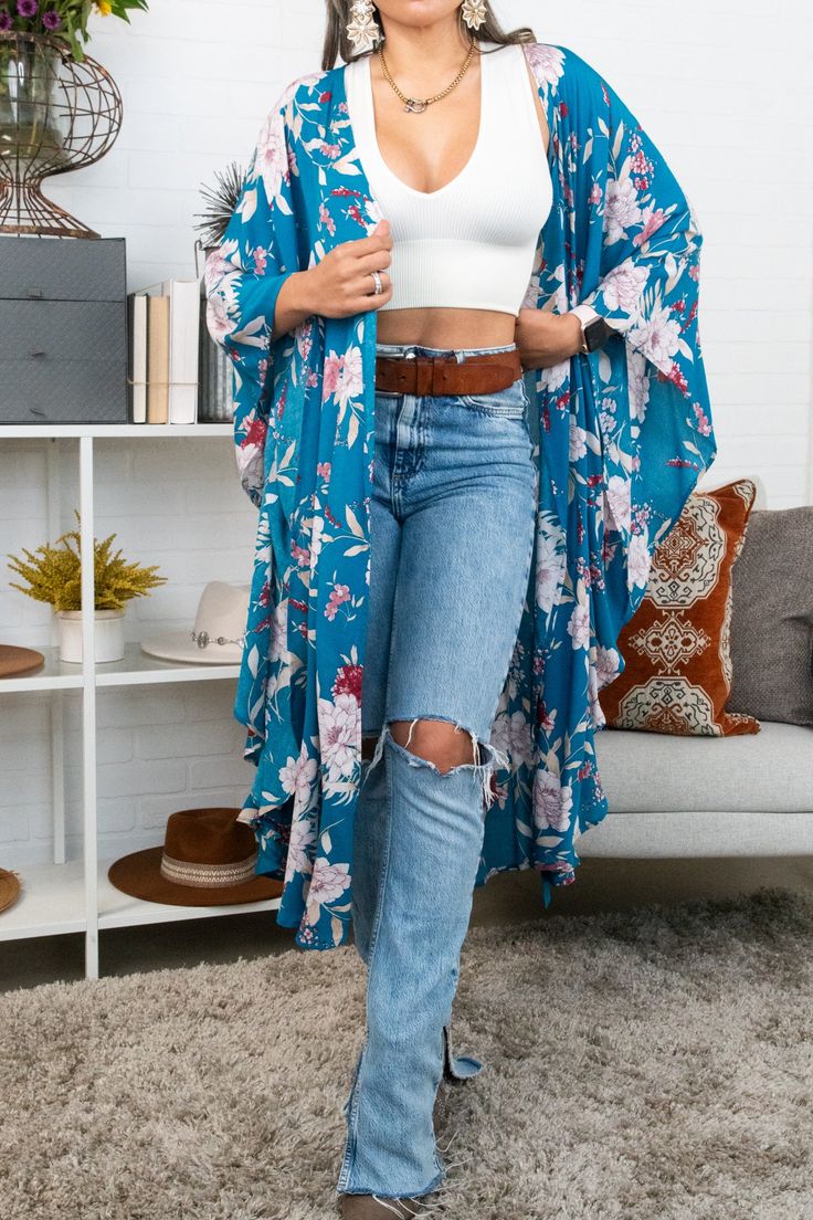 Flutter into fashion with our Floral Butterfly Sleeve Kimono! Featuring a beautiful butterfly print and flowy sleeves, this kimono is the perfect addition to any outfit. Soar with style and embrace your inner free spirit. Spring Flowy Wrap Cover-up, Casual Spring Cover-up With Kimono Sleeves, Flowy V-neck Kimono For Day Out, Flowy Spring Loungewear Cover-up, Spring Fitted Wrap Kimono, Fitted Wrap Kimono For Spring, Long Spring Loungewear Cover-up, Fitted Kimono For Spring Loungewear, Bohemian Wrap Kimono For Brunch