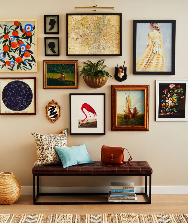 a magazine with pictures on the wall and a bench in front of it, filled with books