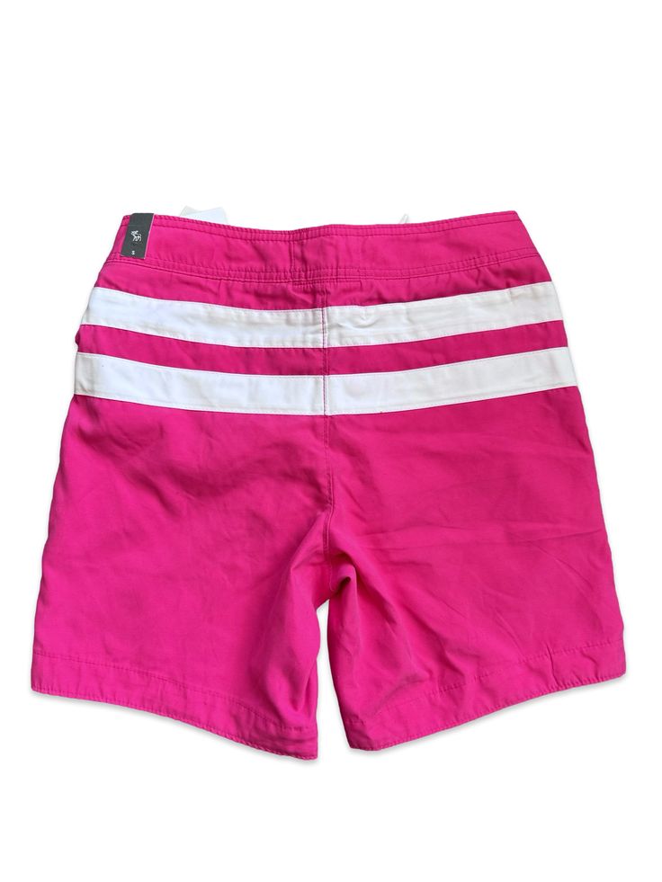 Stay comfortable and stylish in these Abercrombie & Fitch Board Shorts. The magenta color adds a pop of fun to your beach attire. With a size S, these shorts will fit you perfectly. Perfect for all your beach adventures. Size: Small Waist: 30” Length: 16” Condition: New NEW with tags! Magenta Color, Beach Attire, Beach Adventure, British Indian, Papua New Guinea, New New, Small Waist, Board Shorts, Cayman Islands