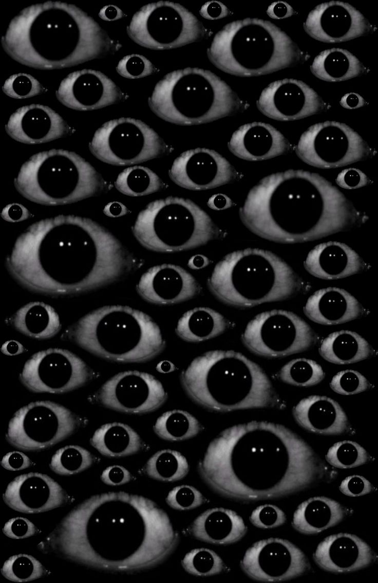 black and white photograph of many eyes in the dark, with only one eye visible