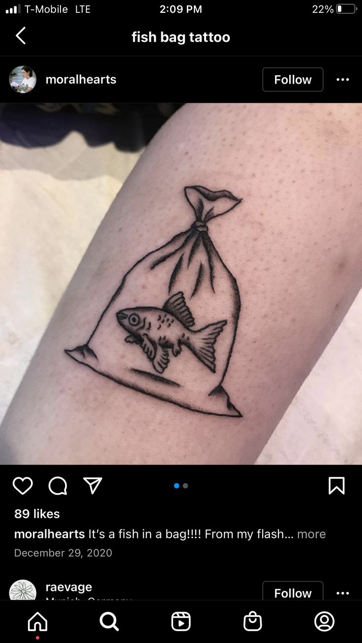 a fish in a bag tattoo on the arm