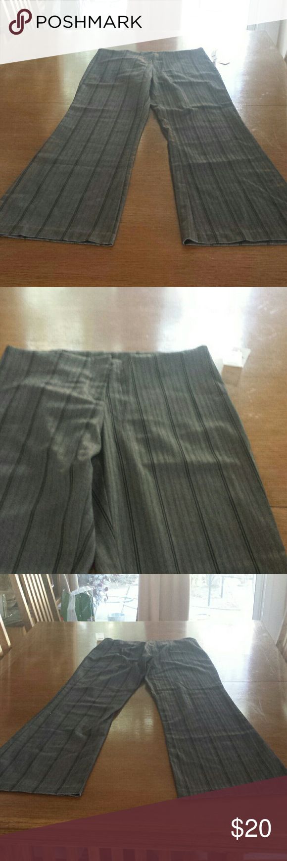 Gray dress  pants   XS  S. M Dark gray dress pants with black pinstripes  Made in USA  65% polyester  32 % rayon 3% spandex  XS waist 33in inseam 32 in S waist  34 in inseam 33 in  M waist  36in  inseam 34 in Isis Pants Trousers Elegant Striped Stretch Pants, Fitted Vertical Stripes Pants For Office, Fitted Striped Pants For Office, Fitted Vertical Stripe Office Pants, Dark Gray Dress, Gray Slacks, Dark Grey Dress Pants, Gray Dress Pants, Grey Slacks