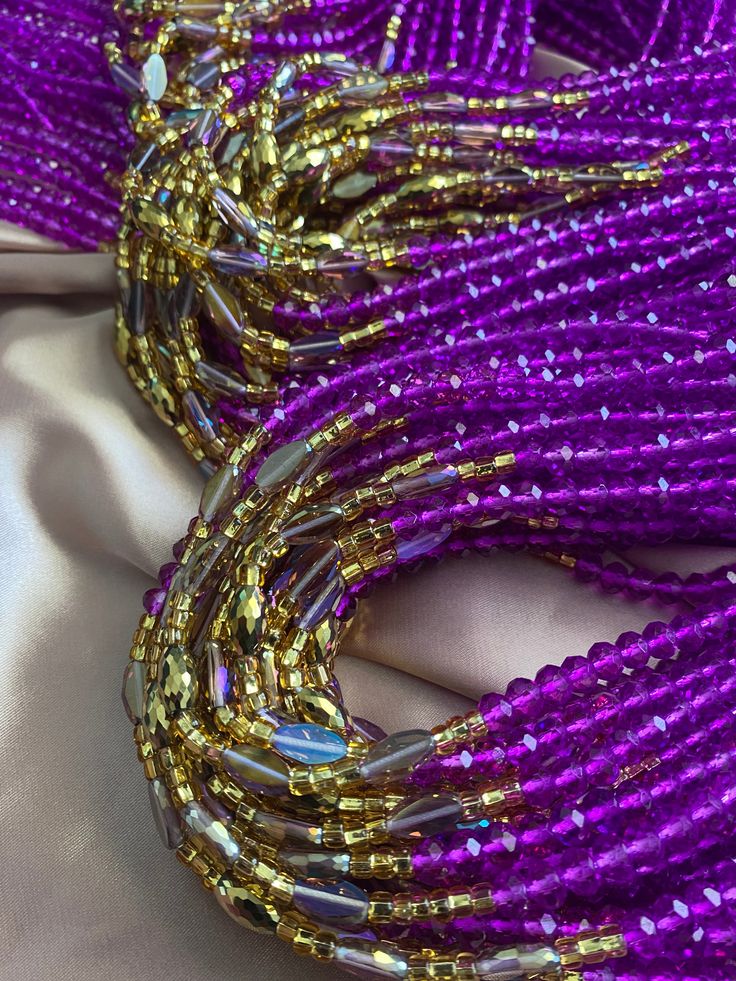 oh these crystal waistBeads 💜🧡🤎 Please note: Due to the process in which pink beads are made, they might change color and turn into clear beads eventually. our exquisite collection of luxury crystal waistbeads, designed to celebrate the inherent beauty and divine femininity within every woman. These tie-on waistbeads are a testament to the power and strength of women, adorned with stunning crystals that symbolize inner radiance and spiritual enlightenment. As you adorn yourself with these wai Crystal Beaded Necklaces For Party, Pink Beaded Crystal Necklaces, Pink Beaded Crystal Necklaces With Round Beads, Oval Beads Beaded Necklaces For Party, Crystal Beaded Necklace With Polished Beads For Party, Gold Beaded Crystal Necklaces, Party Crystal Beaded Necklaces With Polished Beads, Pink Crystal Beaded Bracelets With Round Beads, Pink Crystal Beaded Bracelet With Faceted Beads