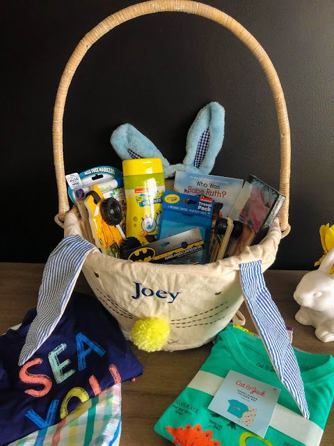 a basket filled with baby items sitting on top of a table