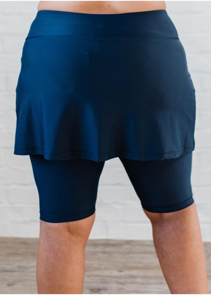 Athleisure Skort With Built-in Shorts For Yoga, Compression Bottoms With Built-in Shorts For Yoga, High Stretch Athleisure Skort With Built-in Shorts, Athleisure Bottoms With Built-in Shorts, Fitted Tennis Skirt With Built-in Shorts For Workout, 4-way Stretch Skort With Built-in Shorts, Workout Mini Skirt With Built-in Shorts, Fitted Navy Skort For Sports, Sporty Fitted Navy Skort