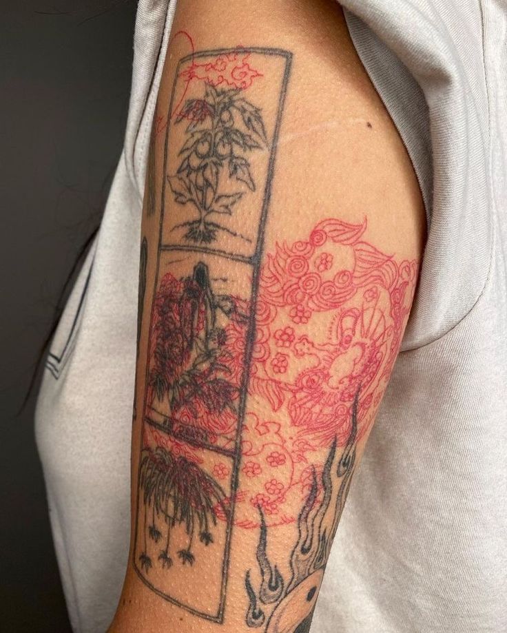 a person with a tattoo on their arm and the back of his arm is covered in red ink