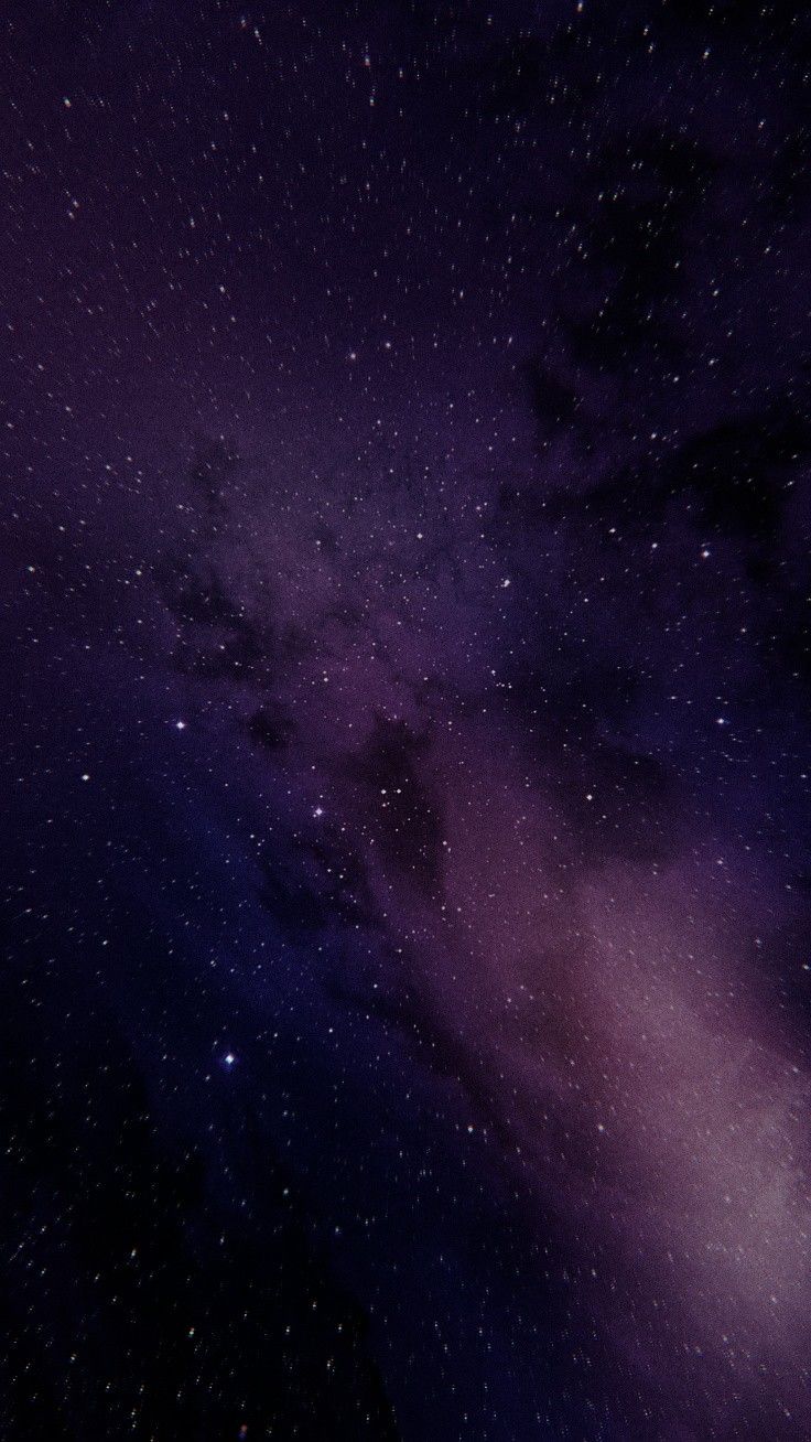 the night sky is filled with stars and purple hues as if it were from outer space