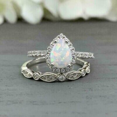 a white opal and diamond ring set