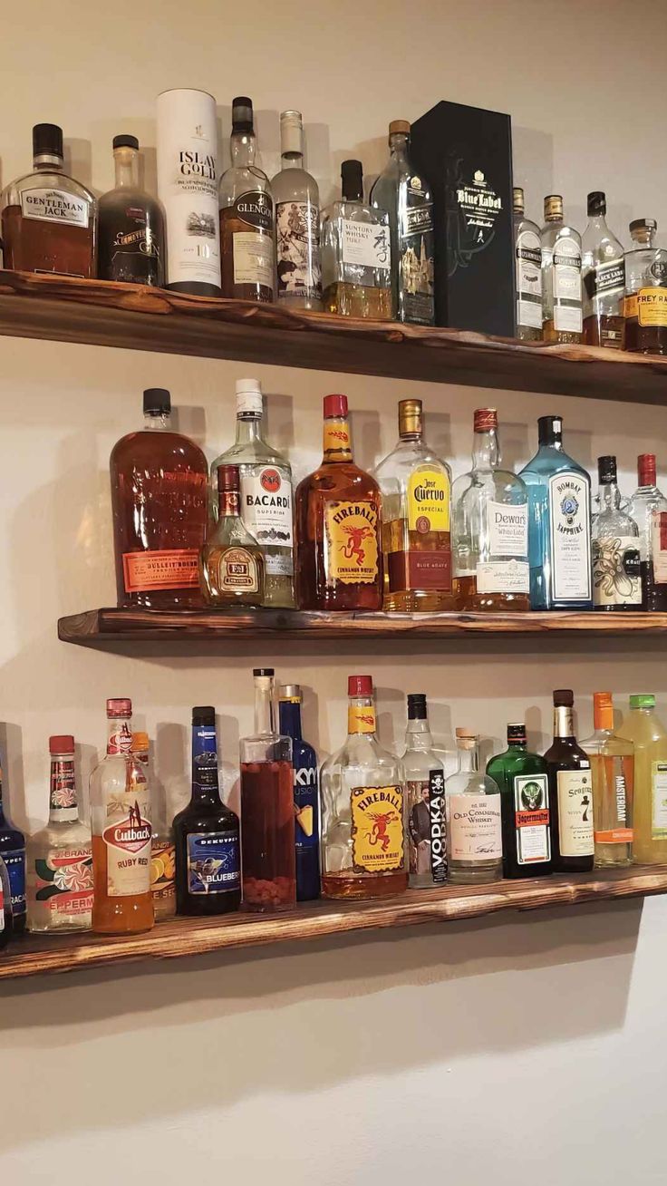 13 Hanging Bar Shelves - DIY Bar Shelf Ideas Bar Shelf Kitchen, Back Of Bar Ideas, Diy Bar Shelves Ideas, Bar Display Shelves, Bar Lights Kitchen, Whisky Shelf Ideas, Diy Bourbon Bar, Bar Stand Ideas For Home, Floating Shelves Bar Ideas