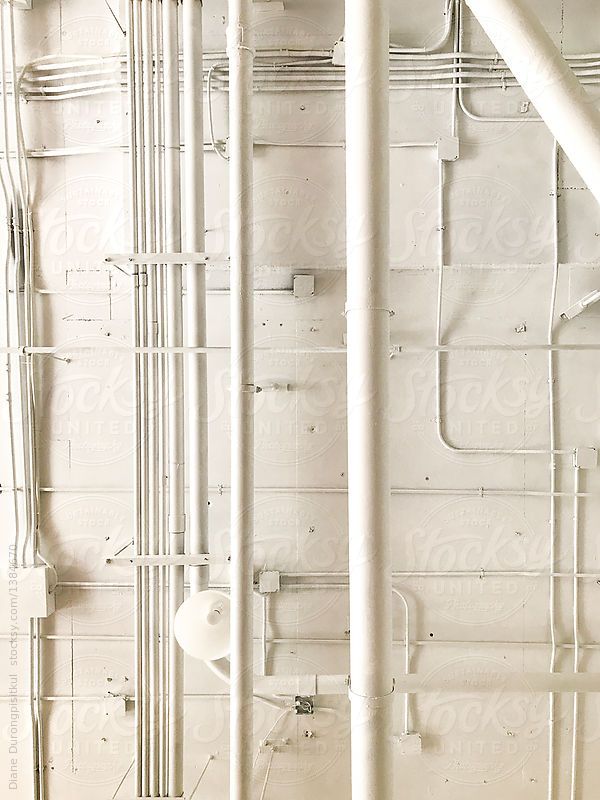 pipes and piping in a white room by jodiko art studio for stocks & bonds