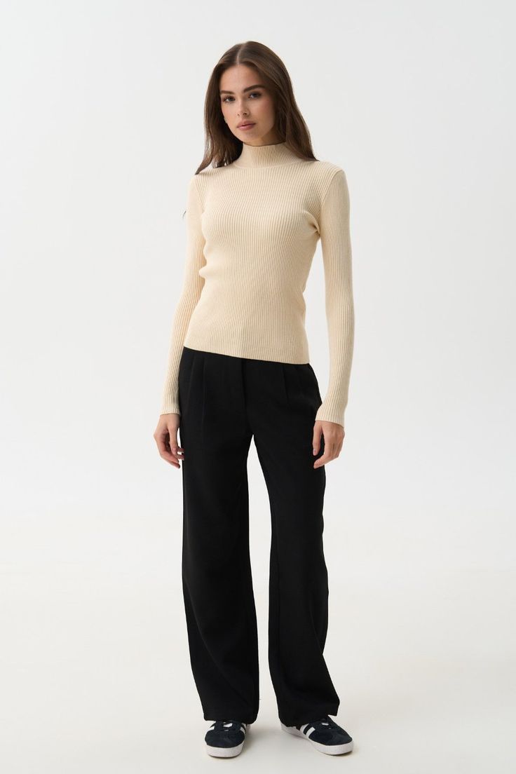 A timeless classic that suits everyone—this ribbed turtleneck with a mock neck is a versatile wardrobe staple. The soft ribbed knit provides warmth and comfort even in cold weather, while beautifully accentuating the silhouette. The mock neck and extended sleeves add a cozy and stylish touch to any outfit. For busy days, pair it with jeans or tailored pieces in neutral shades like black, white, beige, or gray. For special occasions, try combining this turtleneck with a satin skirt—we guarantee y Ribbed Collar Turtleneck For Fall Workwear, Fall Workwear Turtleneck With Ribbed Collar, Fall Turtleneck With Ribbed Collar For Work, Fall Ribbed Collar Turtleneck For Work, Chic Ribbed Sweater For Work, Ribbed Mock Neck Top For Workwear, Solid Color Ribbed Mock Neck Top For Work, Ribbed Mock Neck Top For Work, Classic Stretch Sweater With Ribbed Neckline