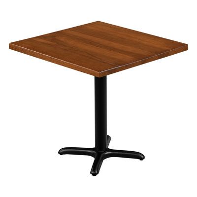 a square wooden table sitting on top of a black metal base