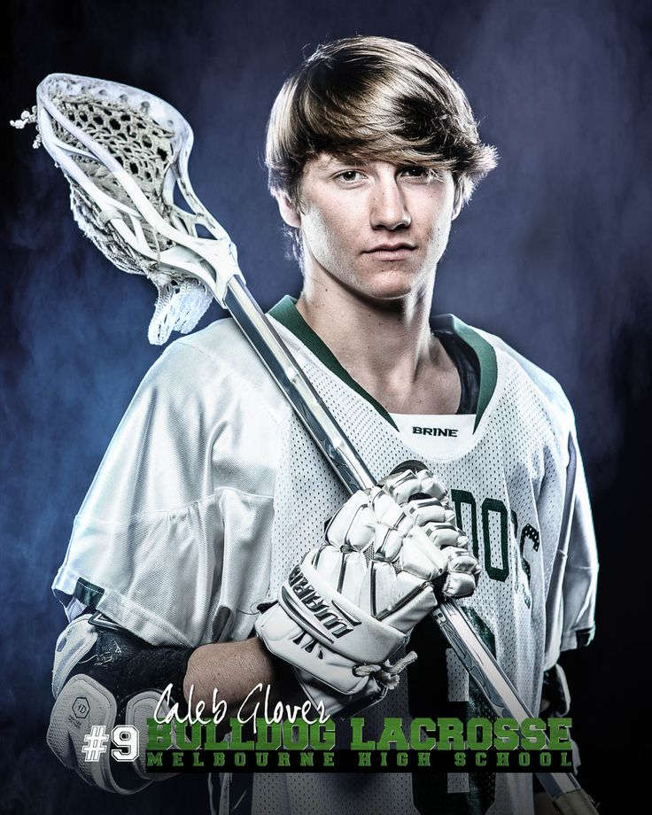 a young man holding a lacrosse stick in his hands