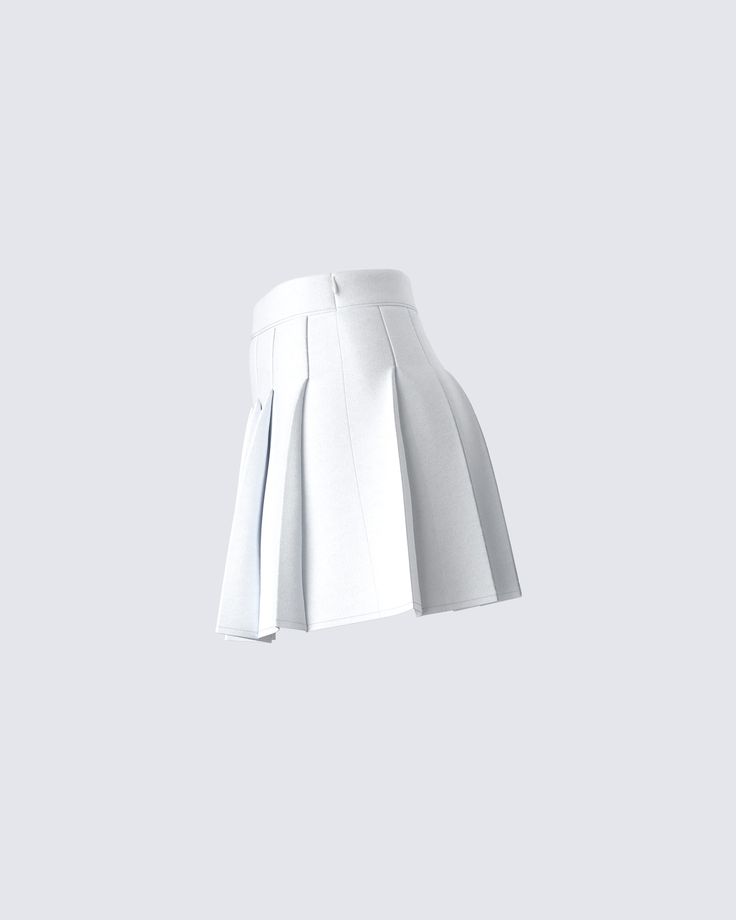 a white pleated skirt hanging from a hook on a gray wall with the bottom section showing