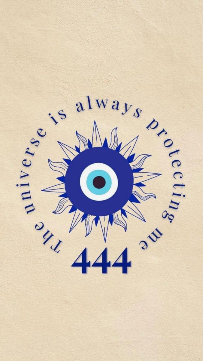 an evil eye on the side of a building with words written in blue and white