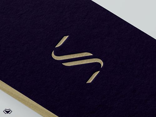 a black and gold business card with the letter n on it's front cover