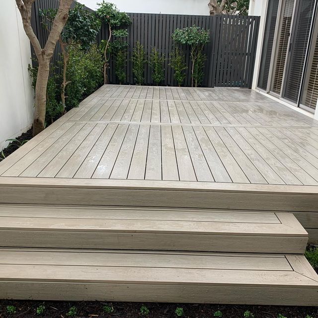 a wooden deck with steps leading up to it