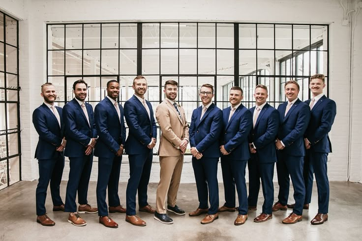 a group of men in suits standing next to each other