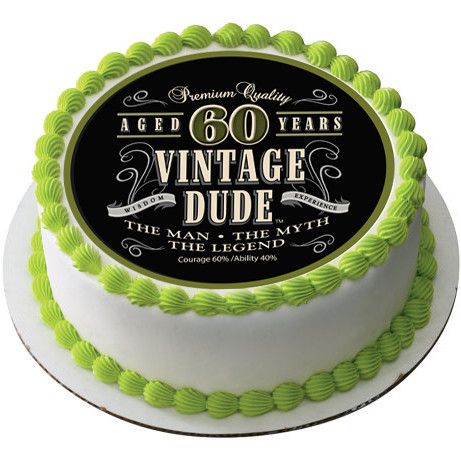 a white cake with green icing and black lettering on top that says age 60 years vintage dude