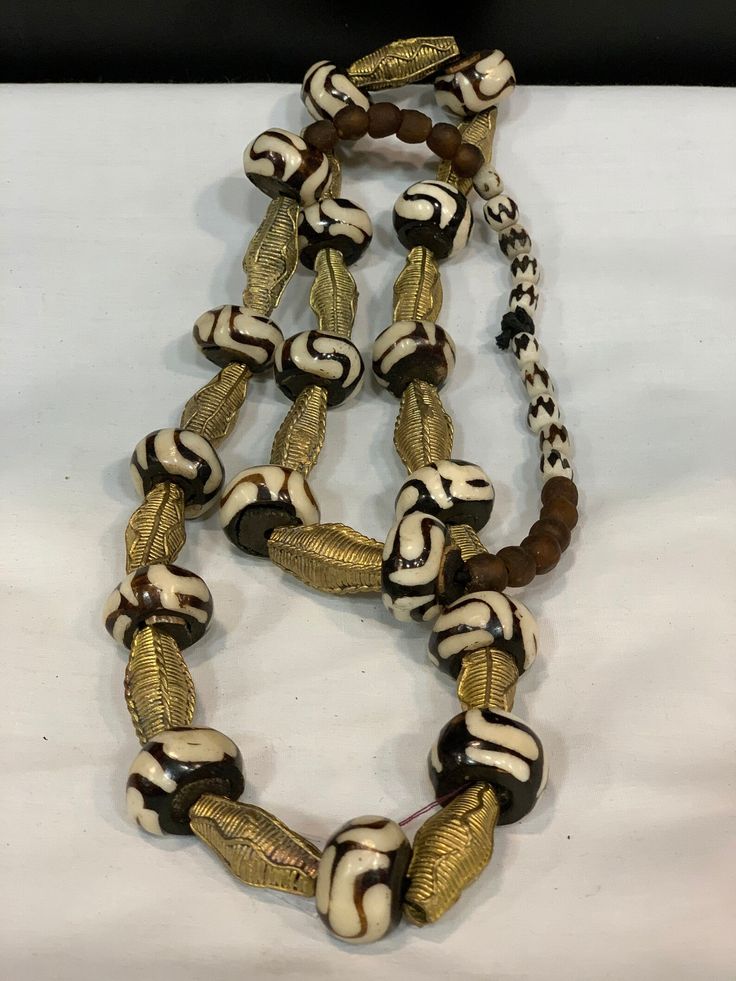 Trade Beads, African Male Jewelry, African Male Necklace, Tribal Necklace, Bone and Brass Necklace, African Jewerly, - Etsy Adjustable Necklace With Large Beads For Rituals, Unique Adjustable Bone-colored Necklace, Traditional Bone-colored Jewelry As A Gift, Traditional Bone-colored Jewelry Gift, Handmade Brown Necklaces For Rituals, Gold Necklaces With Wooden Beads For Festivals, Handmade Artisan Bone-colored Jewelry, Unique Brown Jewelry For Ceremonial Occasions, Bohemian Brown Ceremonial Jewelry