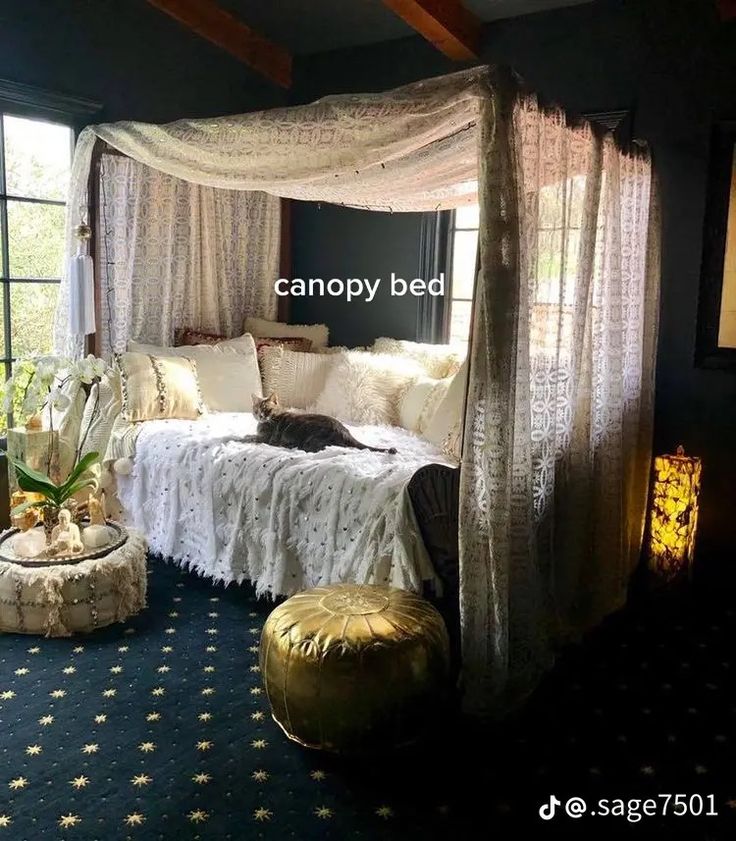 a bedroom with a canopy bed next to a large window and a plant in the corner