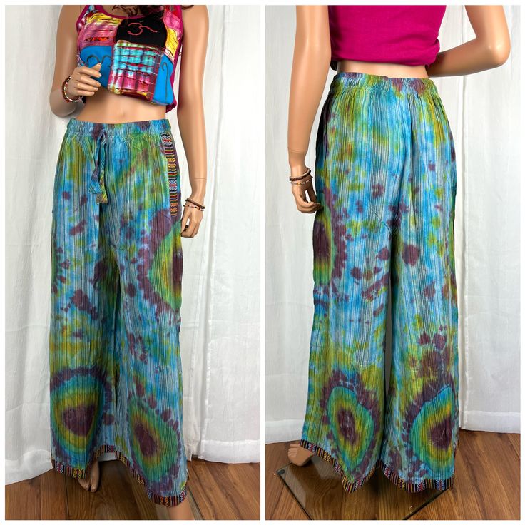 two pictures of a woman wearing wide legged pants and a cropped tank top, both with tie dye patterns on them