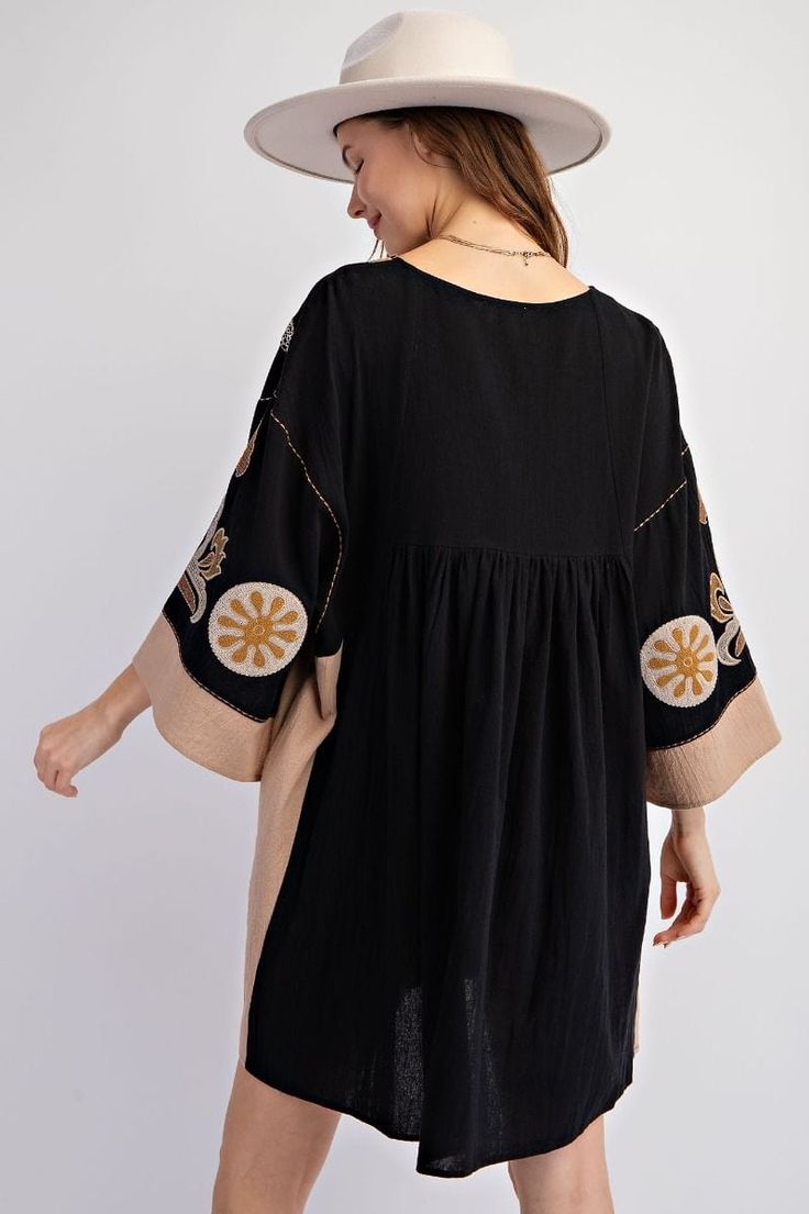 Transform your wardrobe with our Easel Embroidered Poly Linen Woven Dress. Featuring beautiful embroidery on soft, lightweight linen, this playful dress will make you stand out and feel comfortable at the same time. Perfect for any occasion, from brunch to a night out with friends! Details:- V Neck- Dropped Shoulders- 3/4 Sleeves- Embroidery Detailing- Ruching Detailing- Pockets- Loose and Relaxed Fit- Easy Pull Over Style Fabric Content:- 100% Cotton Black Long Sleeve Embroidered Beach Dress, Cotton Dress With Embroidered Hem For Fall, Embroidered Top For Vacation In Fall, Embroidered V-neck Tunic For Spring, Cotton Fall Dress With Embroidered Hem, Fall Cotton Dress With Embroidered Hem, V-neck Embroidered Tunic For Spring, Spring Embroidered V-neck Tunic, Black Embroidered Dress With Geometric Patterns For Spring