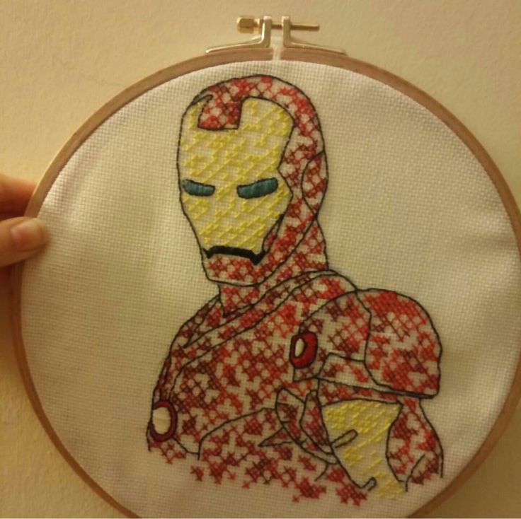 the iron man is in red and white checkered fabric on this hand embroidery project