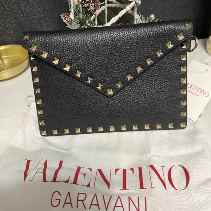 Brand New Valentino Garavani Black Calf Skin Envelope Pouch Evening Envelope Bag With Gold-tone Hardware, Designer Envelope Bag For Formal Occasions, Designer Envelope Shoulder Bag With Gold-tone Hardware, Luxury Envelope Clutch With Gold-tone Hardware, Designer Black Clutch Shoulder Bag, Designer Envelope Evening Bag, Designer Evening Envelope Bag, Designer Black Shoulder Bag Clutch, Designer Envelope Shoulder Bag As Gift