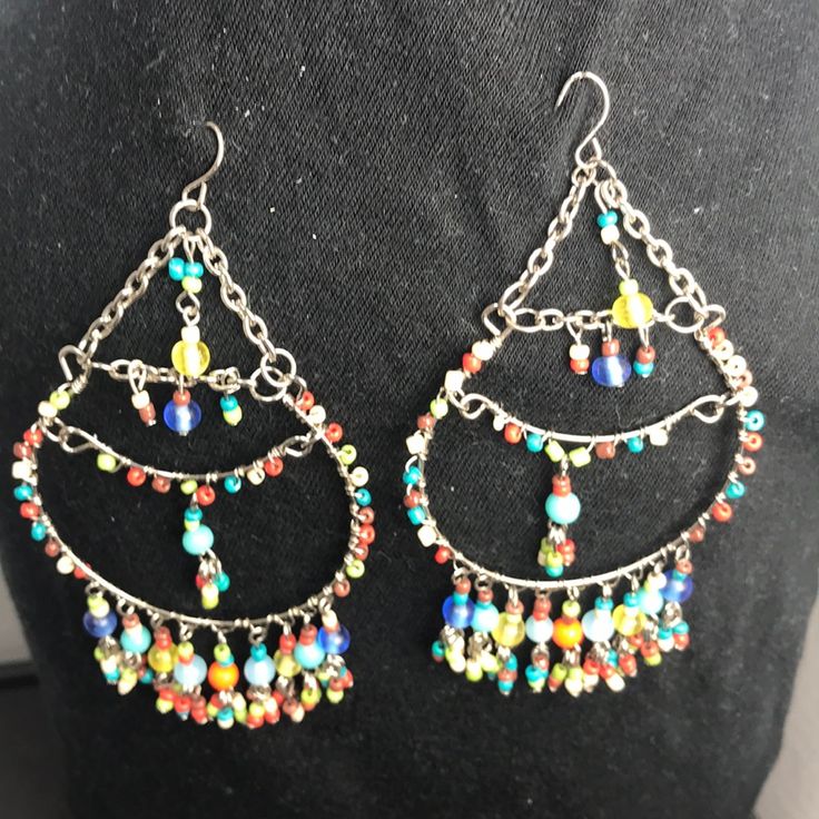 Colorful Beaded Earrings Really Cute On Multicolor Metal Dangle Chandelier Earrings, Handmade Multicolor Metal Chandelier Earrings, Handmade Metal Multicolor Chandelier Earrings, Multicolor Wire Wrapped Beaded Earrings, Multicolor Metal Festival Earrings, Multicolor Metal Earrings With Dangling Beads, Multicolor Metal Beaded Earrings, Multicolor Beaded Metal Earrings With Ear Wire, Multicolor Metal Dangle Hoop Earrings