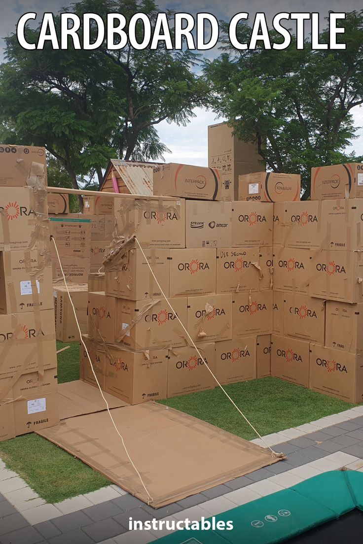 cardboard castle made out of cardboard boxes on the grass with text overlay that reads cardboard castle